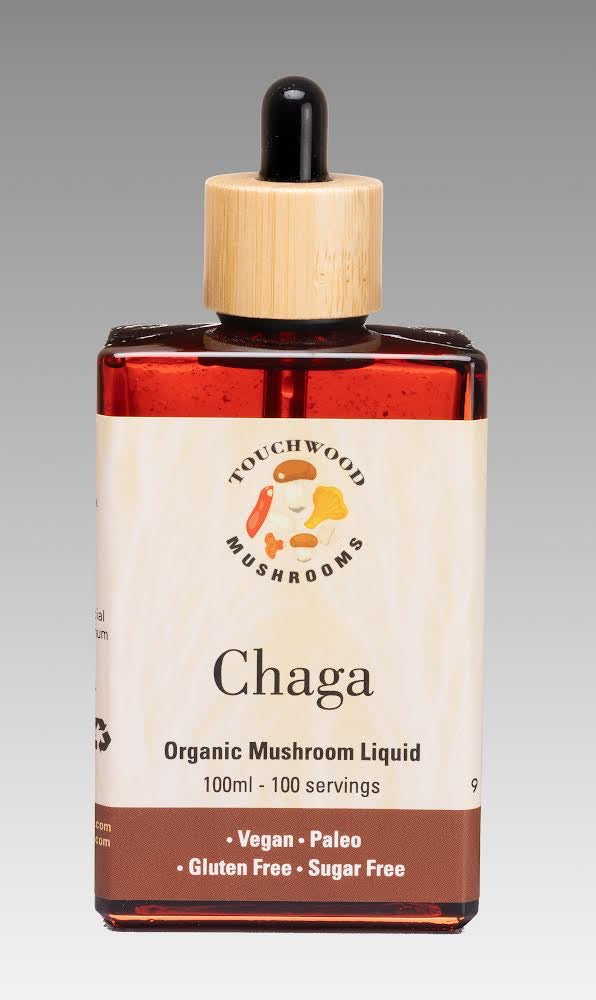 A bottle of Chaga mushroom liquid with a dropper cap, labeled as organic and containing 100 servings.